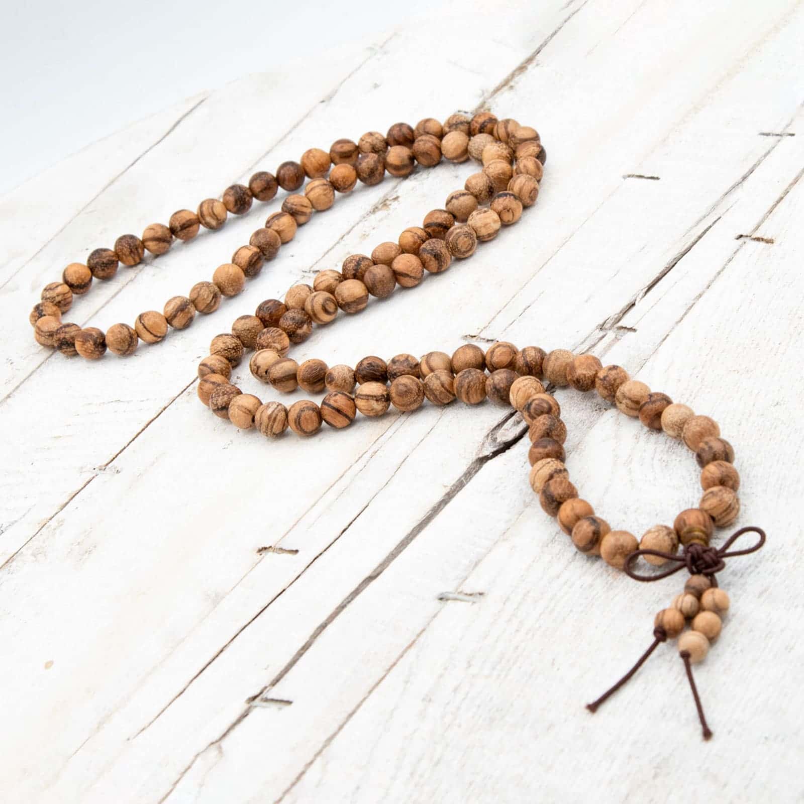 Comprar Japa Mala elástico de madera de Sándalo (Tiger eye) de Patry Montero de Yogimi. Modelo Vida